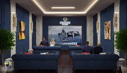 Luksuzno privatno kućno kino modernog dizajna. Luksuzno privatno kućno kino s velikim ekranom, tamnoplavim zidnim panelima i udobnim baršunastim sofama. Ugradbena rasvjeta i dekorativne biljke stvaraju impresivno iskustvo gledanja.
