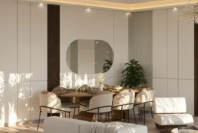 Elegant Modern Dining Room with Chic Table Setting. A modern dining room featuring an oval wooden table set with light upholstered chairs. Elegant wall paneling, an oval mirror, and recessed lighting create a bright, stylish ambiance.