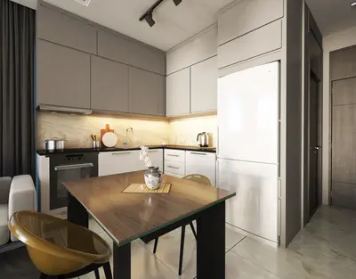 Sleek Modern Kitchen with Integrated Dining Area. A modern, renovated kitchen featuring sleek gray and white cabinetry, integrated appliances, and a wooden dining table. Light tile flooring and under-cabinet lighting complete the contemporary design.