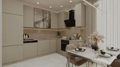 Modern Integrated Kitchen and Dining Area. A modern kitchen and dining area with sleek beige cabinets, integrated appliances, and light-colored tiled flooring. Features include under-cabinet lighting and a set dining table.