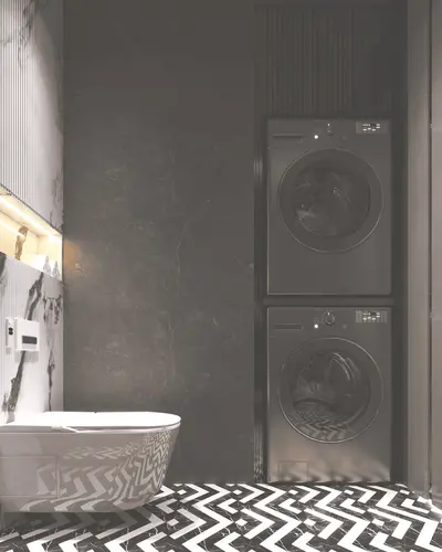 Modern Laundry Room with Integrated WC. A modern, renovated laundry area combined with a WC, featuring stacked washer and dryer units. Stylish black and white zigzag floor and marble walls are illuminated by accent lighting.