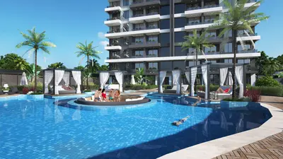 Modern Apartment Complex with Luxurious Outdoor Swimming Pool. A luxurious outdoor swimming pool area with a large blue tiled pool and elegant shaded cabanas. Lush palm trees and a modern apartment building create a resort-style ambiance.