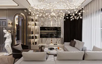 Sophisticated Living Room Boasting Designer Chandelier and Marble Accents. A modern and luxurious living room with a unique leaf-inspired chandelier. Features a stunning marble wall with integrated TV, plush white sofas, and stylish illuminated display shelving.