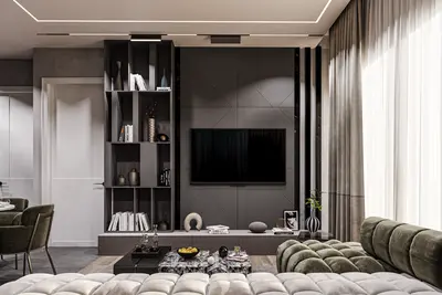 Modern Luxury Living Room with Sleek Entertainment Unit. A modern living room featuring a large wall-mounted television on a stylish textured accent wall. It has sleek built-in shelving, elegant recessed ceiling lighting, and sheer curtains, creating a luxurious atmosphere.
