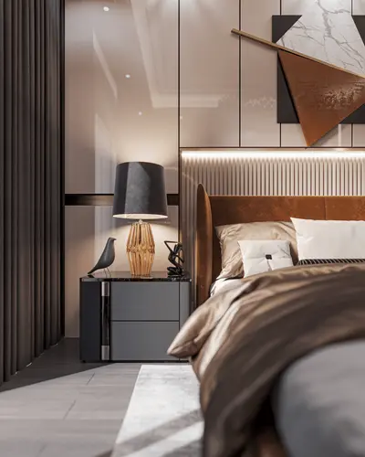 Elegant Master Bedroom with Contemporary Furnishings. A beautifully designed modern bedroom featuring a plush bed with a brown upholstered headboard, a dark gray bedside table, and a golden decorative lamp, complemented by chic wall art and dark curtains.