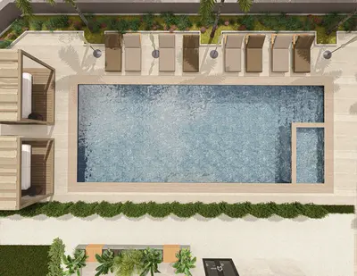 Luxury Outdoor Swimming Pool Area with Sun Loungers. An aerial view of a modern outdoor swimming pool area, featuring a large rectangular pool, sun loungers, and two private cabanas on a paved deck. Lush green landscaping and palm trees surround the renovated facility.