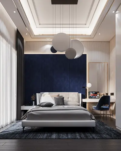 Modern Master Bedroom with Elegant Decor and Desk Area. A modern and elegant bedroom with a comfortable bed, dark wood floor, and a large rug. Features a stylish desk, contemporary lighting, and a sophisticated ceiling design.