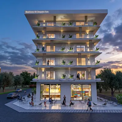 Modern Apartment Building Exterior with Balconies and Shops. A modern multi-story apartment building with illuminated balconies, featuring ground-floor commercial shops and an outdoor cafe area, set against a beautiful dusk sky with trees.