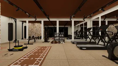 Modern Equipped Gym with Treadmills and Training Area. A modern, well-lit gym with rubber flooring and mirrored walls. Features include multiple treadmills, a punching bag, sled, free weights, and kettlebells.