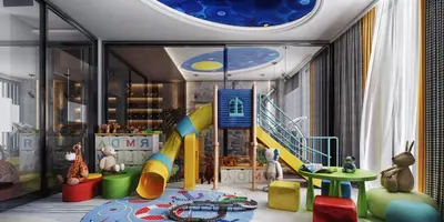 Vibrant Children's Playroom with Indoor Slide and Toys. A vibrant, modern children's playroom featuring a large yellow and blue indoor slide with stairs, a colorful circular rug, and a small green table with stools. Decorated with toys and a unique blue ceiling design.