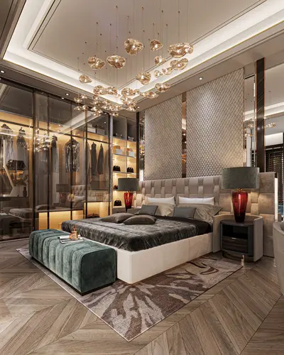 Luxury Master Bedroom with Walk-in Closet and Modern Lighting. A luxurious and modern master bedroom featuring chevron wooden flooring, a large bed, and a unique artistic chandelier. It includes a sophisticated built-in glass walk-in closet and ambient lighting.