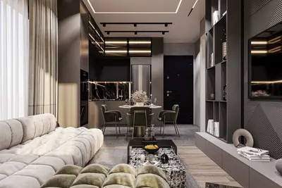 Modern Open-Plan Living Room and Kitchen Area. A contemporary open-plan living room and kitchen featuring a large light modular sofa, a stylish dining area, and a sleek dark kitchen with marble countertops. Integrated lighting and a built-in bookshelf enhance the sophisticated design.