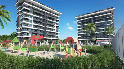 Modern Apartment Complex with Vibrant Children's Playground. Modern high-rise apartment buildings with a vibrant outdoor children's playground. The area includes swings, slides, and green landscaping, providing a family-friendly residential amenity.