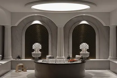 Luxurious Modern Hammam Spa with Marble Design. A luxurious Hammam spa bathroom with white marble walls and flooring. Features ornate shell basins, golden mosaic arches, a central marble platform, and soft lighting for a modern traditional feel.