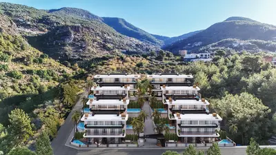 Luxury Mountain View Apartments with Private Pools. Aerial view of a modern luxury apartment complex against a green mountain. Features multi-story buildings, private balcony pools, and a lush, natural setting under a clear sky.