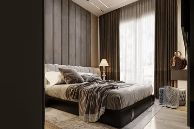 Luxury Modern Master Bedroom with Plush Headboard. A luxurious modern bedroom featuring a king-size bed with a grey padded headboard. Large windows with elegant curtains provide natural light, complementing the wooden floor and stylish decor.