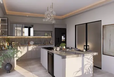 Modern Kitchen with Marble Island, Smart Fridge, and Elegant Lighting. Modern renovated kitchen featuring a large marble island, sleek light grey cabinetry, and a black smart refrigerator. Illuminated by under-cabinet and ceiling lighting, with tiled flooring.