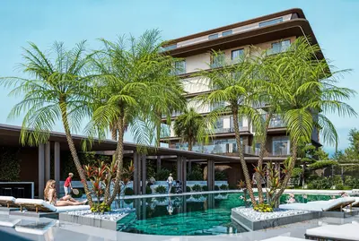 Luxury Outdoor Swimming Pool at Modern Residential Complex. A modern outdoor swimming pool area with turquoise water, surrounded by lush palm trees and sun loungers. A luxurious residential building stands in the background, offering a resort-style living experience.