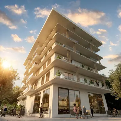 Modern Residential Building Exterior with Balconies and Social Space. Exterior view of a modern multi-story residential building with striking cantilevered balconies and glass railings. The ground floor features an inviting outdoor cafe area, bathed in warm sunlight.