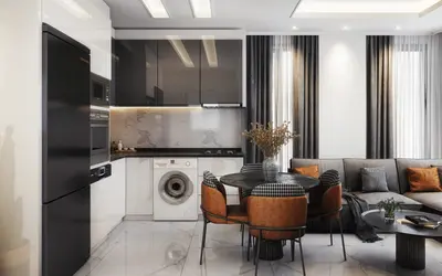 Moderni integrisani dnevni boravak s kuhinjom i trpezarijom. Moderno renoviran dnevni boravak otvorenog plana s kuhinjom. Uključuje mermerni backsplash, integrisane uređaje, mašinu za veš, sivi ugaoni kauč i stilski trpezarijski namještaj.