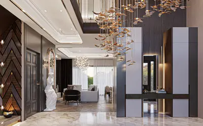 Luxurious Entrance Hall with Grand Chandelier and Marble Flooring. Luxurious entrance hall featuring polished marble flooring and a spectacular multi-tiered chandelier. Modern dark wood paneling, a decorative statue, and elegant console table lead to the spacious living area.