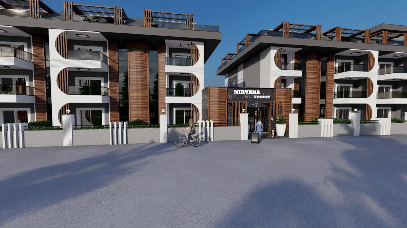 التصميم الخارجي لمجمع سكني حديث بواجهة أنيقة. يتميز التصميم الخارجي لمجمع شقق سكنية حديث يسمى 'NIRVANA FOREST' بألواح خشبية وبيضاء أنيقة، وشرفات زجاجية، ومدخل مصمم بشكل جيد تحت سماء زرقاء صافية.
