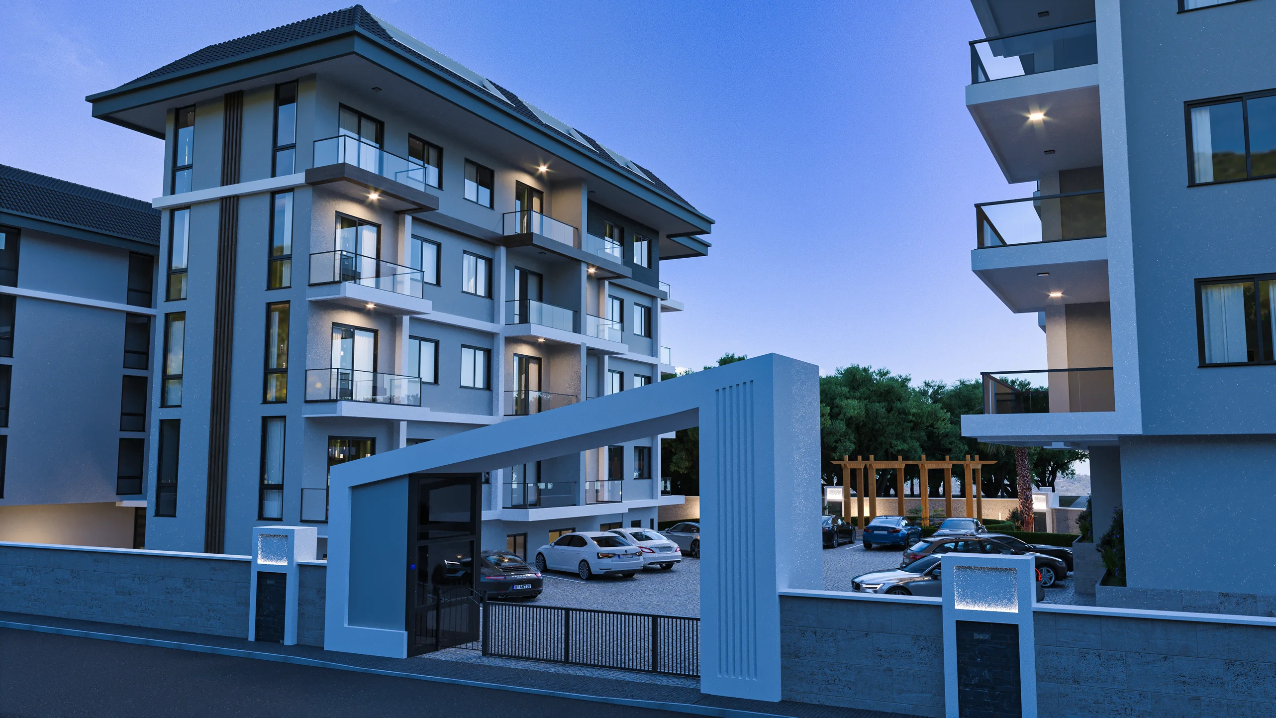 Modern Apartment Complex Exterior with Gated Parking Area. The exterior of a modern apartment complex features a sleek grey facade, glass balconies, a stylish gated entrance, and a well-lit outdoor parking lot with landscaping.